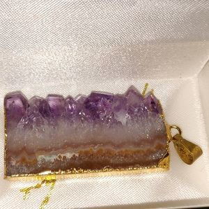 Gold accented gemstone pendant